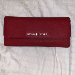 Red Michael Kors leather tri-fold wallet